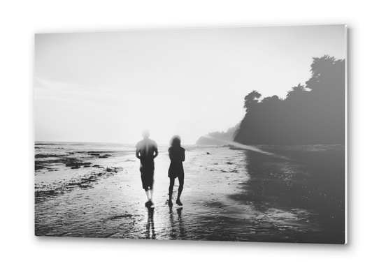 walking on the with sunset light in black and white Metal prints by Timmy333