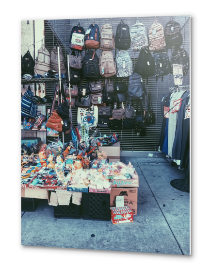 backpack and toy shop on the footpath Metal prints by Timmy333