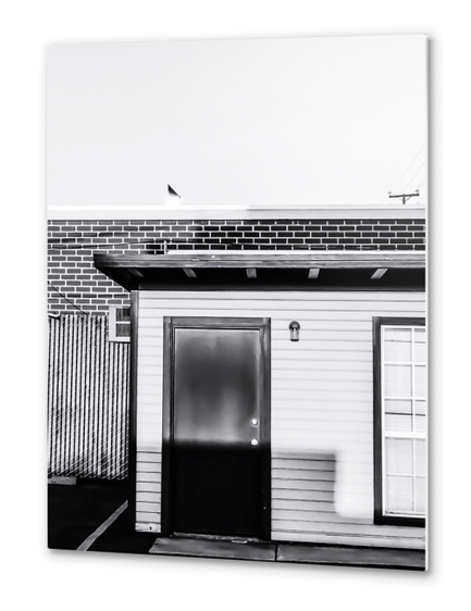 wood building with brick building background in black and white Metal prints by Timmy333