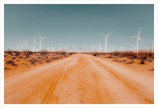 Wind turbine in the desert with sandy road at Kern County California USA Art Print by Timmy333