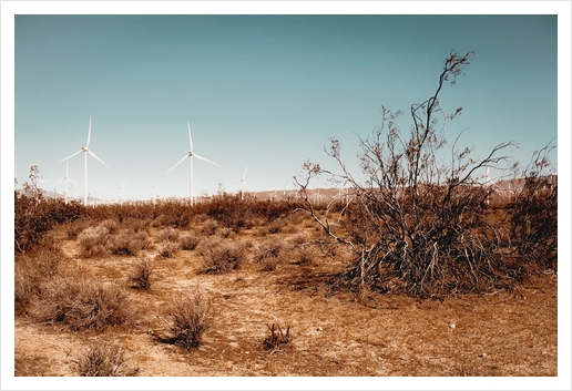 Desert and wind turbine with blue sky at Kern County California USA Art Print by Timmy333