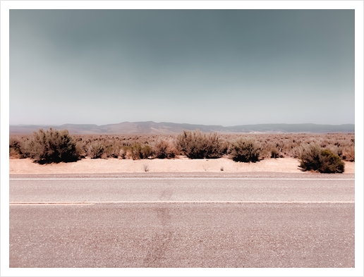 Road in the desert with blue sky in California USA Art Print by Timmy333