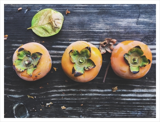 persimmons on the wooden table Art Print by Timmy333