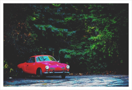 red classic car in the forest with green tree background Art Print by Timmy333