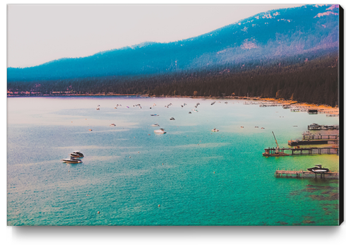 Boat on the water and mountain background at Lake Tahoe Nevada USA Canvas Print by Timmy333