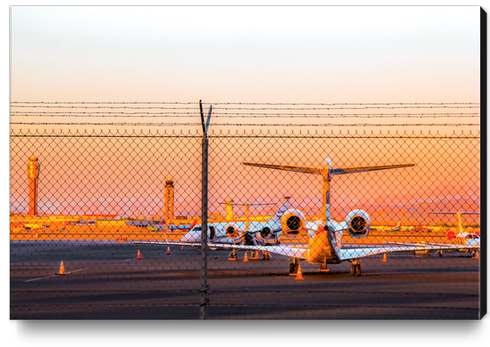 Airplane at Las Vegas airport USA with sunset sky Canvas Print by Timmy333