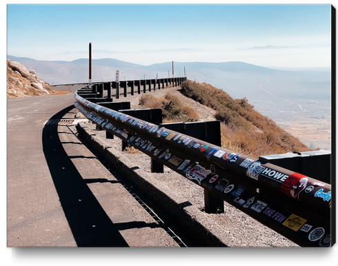 metal road fencing with mountain view in California USA Canvas Print by Timmy333