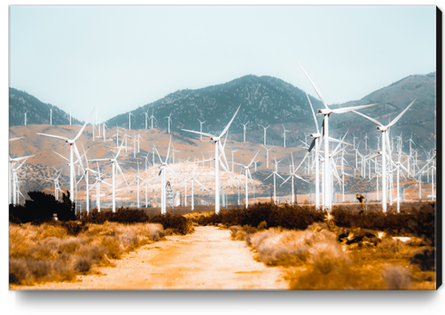 Wind turbine in the desert with mountain background at Kern County California USA  Canvas Print by Timmy333