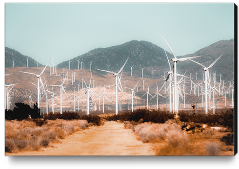 Wind turbine in the desert with mountain background at Kern County California USA Canvas Print by Timmy333