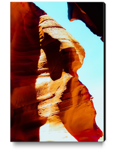 Orange sandstone abstract with blue sky at Antelope Canyon, Arizona, USA Canvas Print by Timmy333