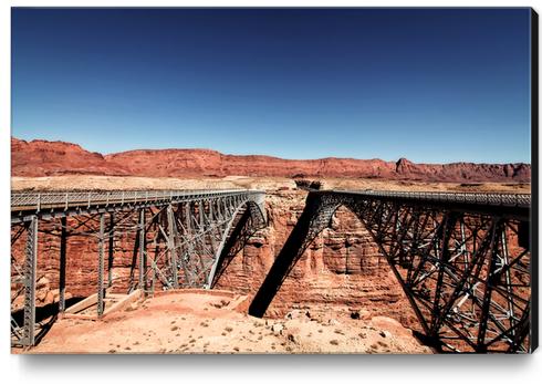 bridge in the desert with blue sky at Utah, USA Canvas Print by Timmy333