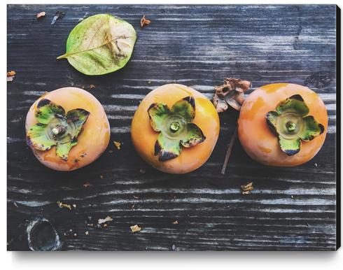 persimmons on the wooden table Canvas Print by Timmy333