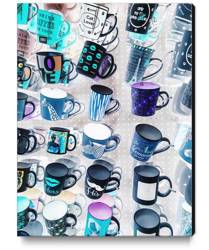 colorful mugs hanging on the white wall Canvas Print by Timmy333