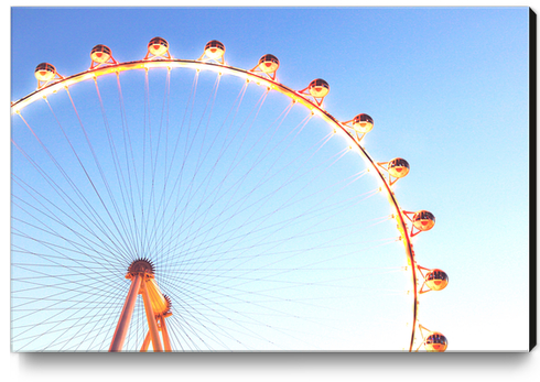 orange Ferris Wheel in the city with blue sky  Canvas Print by Timmy333