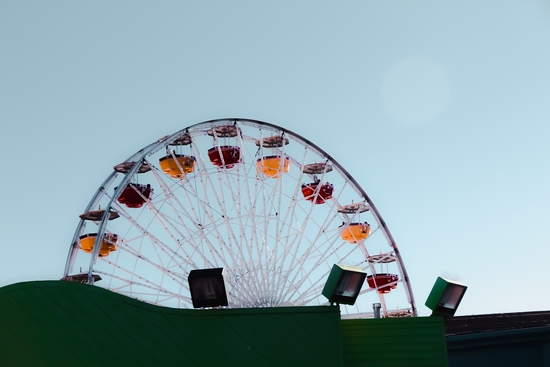 colorful ferris wheel at Santa Monica pier California USA with blue sky by Timmy333