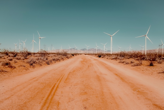 Wind turbine in the desert with sandy road at Kern County California USA by Timmy333