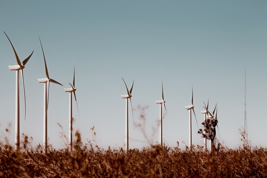 Wind turbine in the desert with blue sky at Kern County California USA by Timmy333