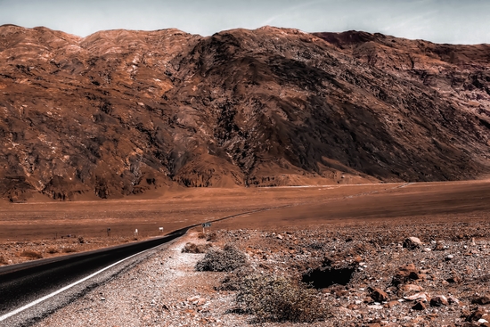 road in the desert with mountain view at Death Valley national park California USA by Timmy333