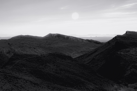 mountain in the desert with summer sky at Red rock canyon state park California in black and white by Timmy333