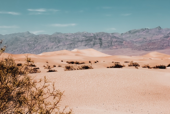 Sandy desert with mountain background at Death Valley national park California USA by Timmy333