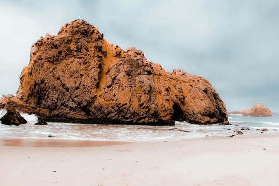 Big stone in the sandy beach at Pfeiffer Beach, Big Sur, California, USA by Timmy333