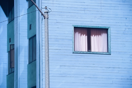 vintage blue wood building with window and electric pole by Timmy333