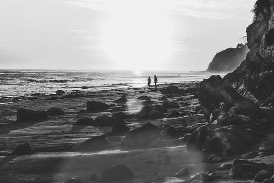 summer sunset at the beach with strong sunlight in black and white by Timmy333