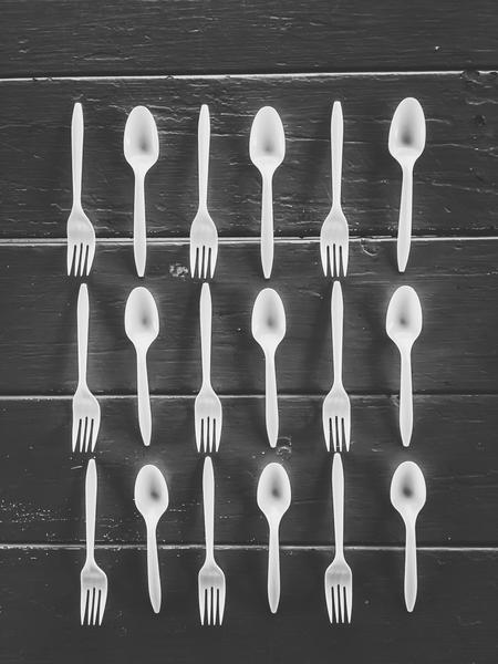 forks and spoons on the wooden table in black and white by Timmy333