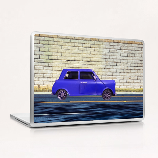 blue classic car on the road with brick wall background Laptop & iPad Skin by Timmy333