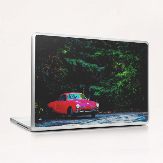 red classic car in the forest with green tree background Laptop & iPad Skin by Timmy333