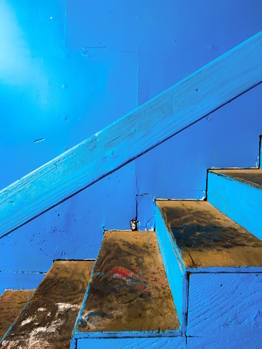 blue and brown old wood stairs with blue wall background Mural by Timmy333